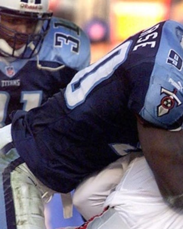Tennessee Titans defense end Jevon Kearse sets a NFL record for sack in a season for a rookie as he takes down Atlanta Falcons quarterback Tony Graziani (7) on this play as the Titans defeated the Atlanta 30-17 to clinched a playoff berth at Adelphia Coliseum Dec. 19, 1999.
