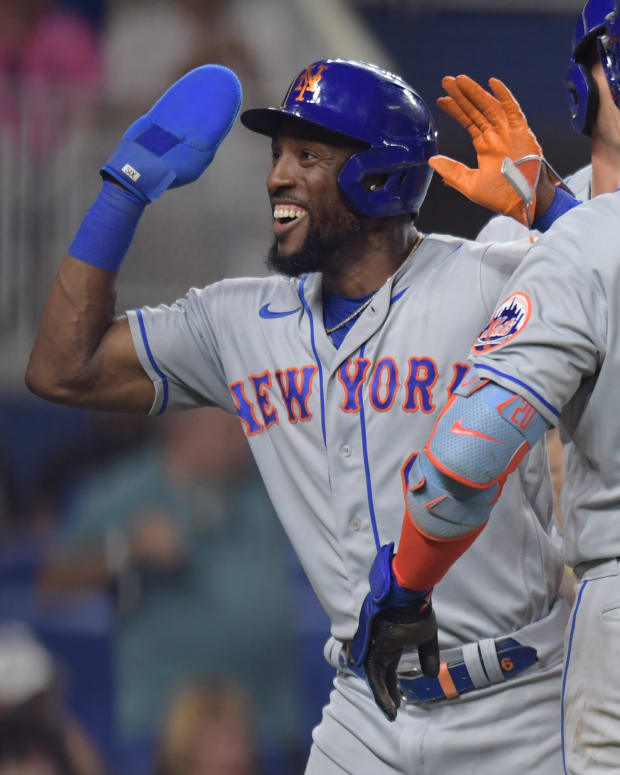 Jun 24, 2022; Miami, Florida, USA; New York Mets right fielder Starling Marte (6) celebrates after scoring a run in the sixth inning with first baseman Pete Alonso (20) and center fielder Brandon Nimmo (back) in the sixth inning against the Miami Marlins at loanDepot Park.