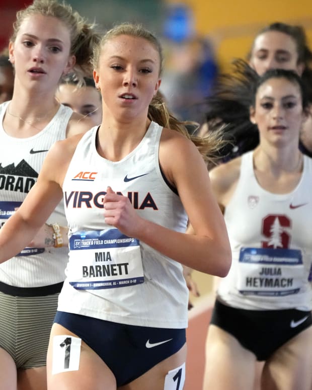 Mia Barnett of Virginia runs in a women's mile heat during the NCAA Indoor Track and Field Championships at Crossplex.