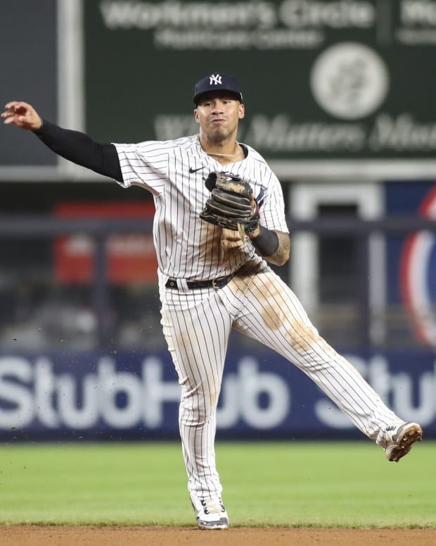 New York Yankees 2B Gleyber Torres throws to first base