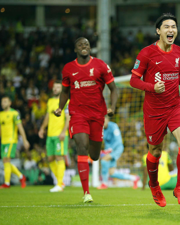 Takumi Minamino pictured celebrating after scoring for Liverpool against Norwich City in the 2021/22 EFL Cup