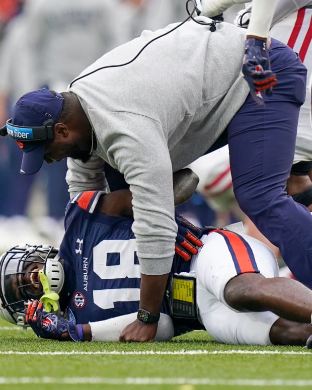 Dec 28, 2021; Birmingham, Alabama, USA; Auburn Tigers defensive coach Zac Etheridge celebrates with Auburn Tigers cornerback Nehemiah Pritchett (18) after he intercepted a pass against Houston Cougars during the second half of the 2021 Birmingham Bowl at Protective Stadium. Mandatory Credit: Marvin Gentry-USA TODAY Sports