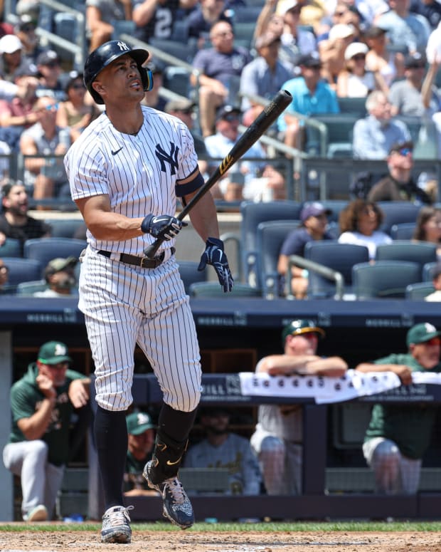 New York Yankees DH Giancarlo Stanton watches home run