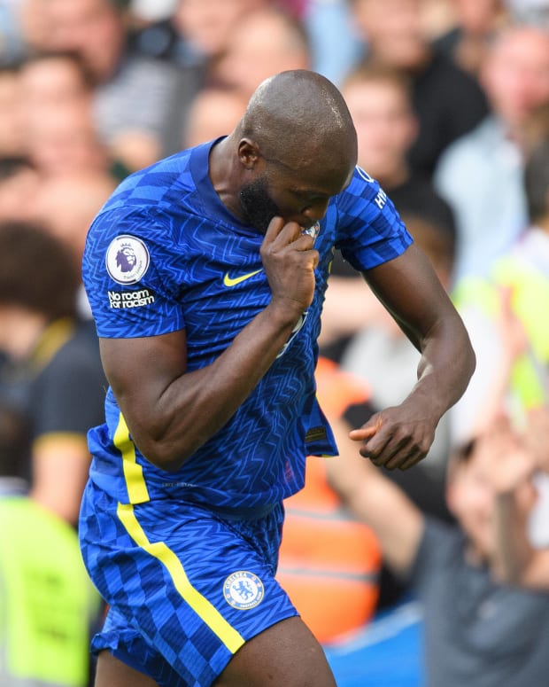 Romelu Lukaku pictured kissing the Chelsea badge on his jersey after scoring in a 3-0 win over Aston Villa in September 2021