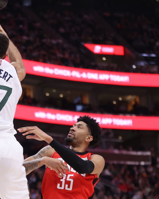 Utah Jazz center Rudy Gobert (27) dunks the ball against Houston Rockets center Christian Wood (35) in the third quarter at Vivint Arena.