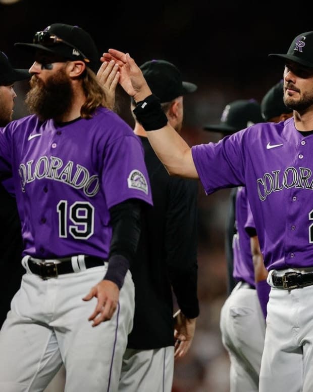 Jul 2, 2022; Denver, Colorado, USA; Colorado Rockies designated hitter Charlie Blackmon (19) and left fielder Kris Bryant (23) celebrate with teammates after the game against the Arizona Diamondbacks at Coors Field. Mandatory Credit: Isaiah J. Downing-USA TODAY Sports