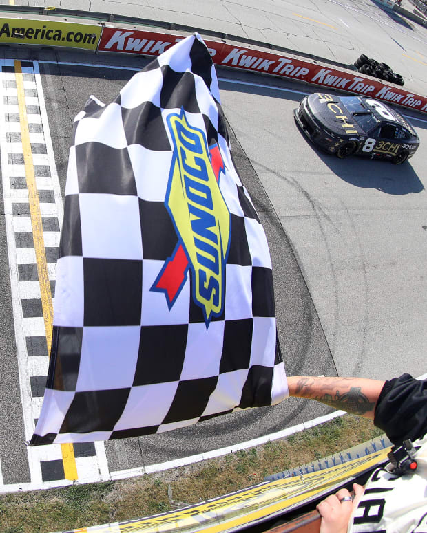 Tyler Reddick takes the checkered flag to win the NASCAR Cup Series Kwik Trip 250 at Road America on Sunday. (Photo by Logan Riely/Getty Images)
