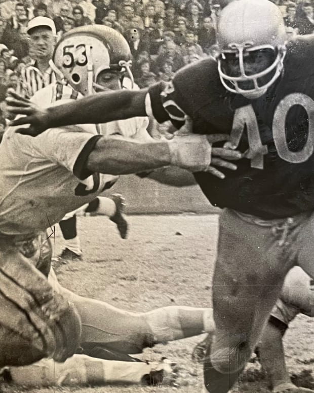 Donnie Moore runs against Ohio State in 1965.
