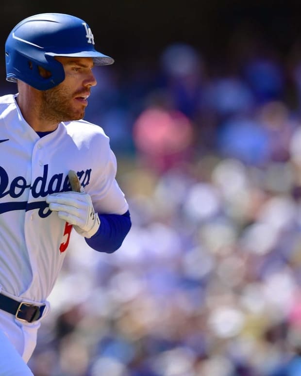 Jul 3, 2022; Los Angeles, California, USA; Los Angeles Dodgers first baseman Freddie Freeman (5) runs after hitting a single against the San Diego Padres during the fourth inning at Dodger Stadium. Mandatory Credit: Gary A. Vasquez-USA TODAY Sports