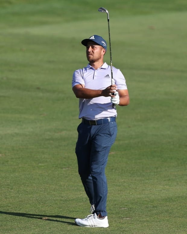 Jun 26, 2022; Cromwell, Connecticut, USA; Xander Schauffele plays a shot from the fairway of the 18th hole during the final round of the Travelers Championship golf tournament. Mandatory Credit: Vincent Carchietta-USA TODAY Sports