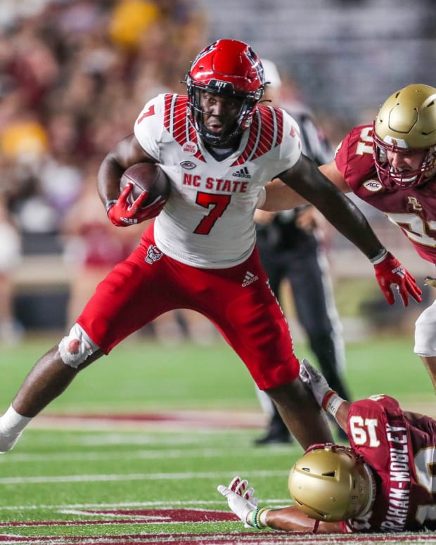 NC State RB Zonovan Knight runs with football