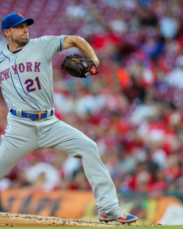 Jul 5, 2022; Cincinnati, Ohio, USA; New York Mets starting pitcher Max Scherzer (21) pitches during the second inning against the Cincinnati Reds at Great American Ball Park.