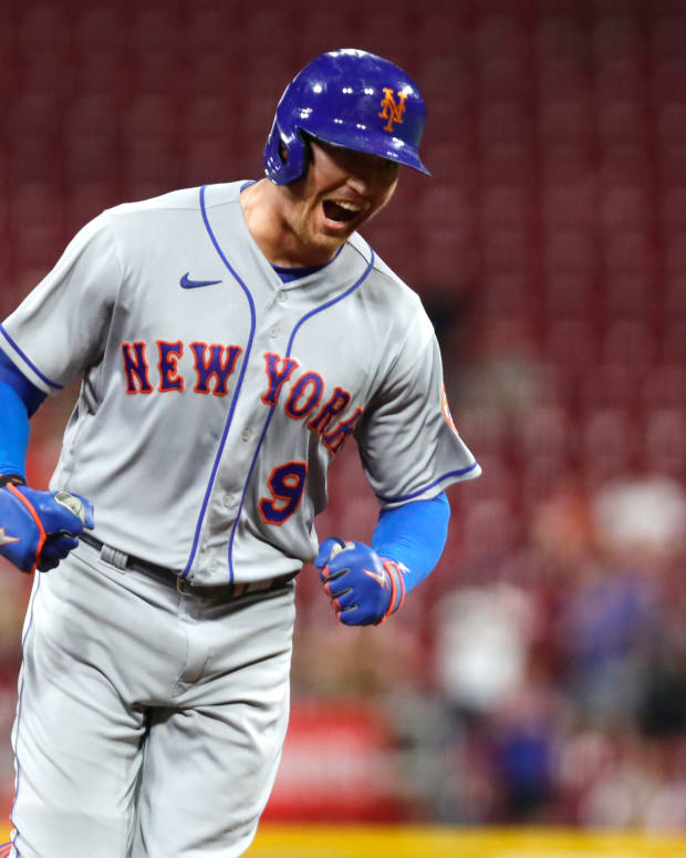 Jul 6, 2022; Cincinnati, Ohio, USA; New York Mets center fielder Brandon Nimmo (9) reacts as he runs the bases after hitting a three-home run against the Cincinnati Reds in the tenth inning at Great American Ball Park.