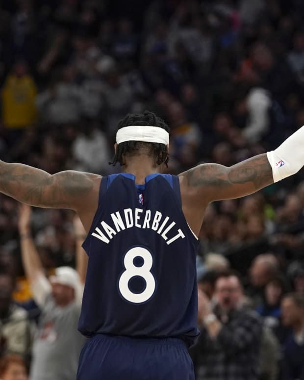 Minnesota Timberwolves forward Jarred Vanderbilt (8) reacts with the crowd against the Los Angeles Lakers during the second quarter at Target Center.