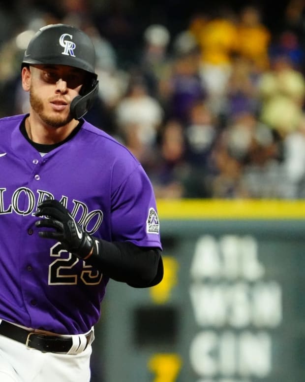 Jul 15, 2022; Denver, Colorado, USA; Colorado Rockies first baseman C.J. Cron (25) runs out a solo home run in the seventh inning against the Pittsburgh Pirates at Coors Field. Mandatory Credit: Ron Chenoy-USA TODAY Sports