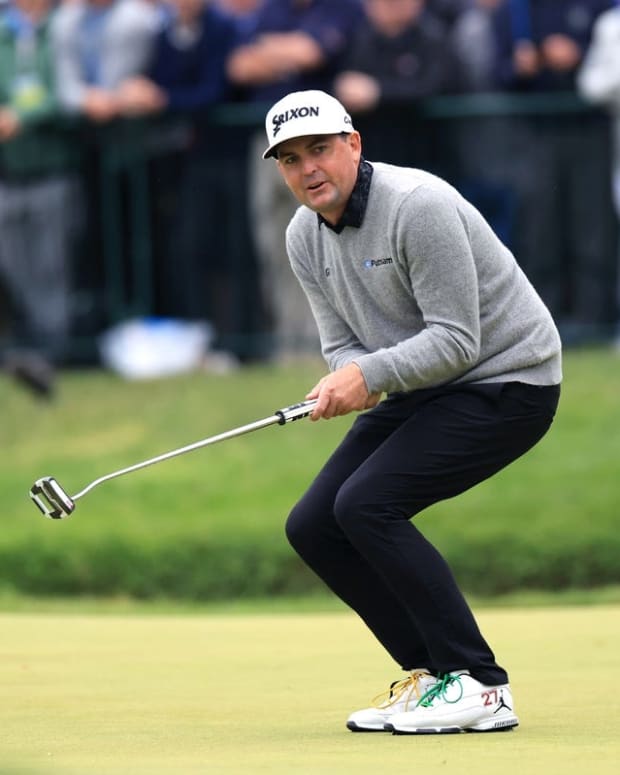 Jun 19, 2022; Brookline, Massachusetts, USA; Keegan Bradley watches his putt on the 18th green during the final round of the U.S. Open golf tournament. Mandatory Credit: Aaron Doster-USA TODAY Sports