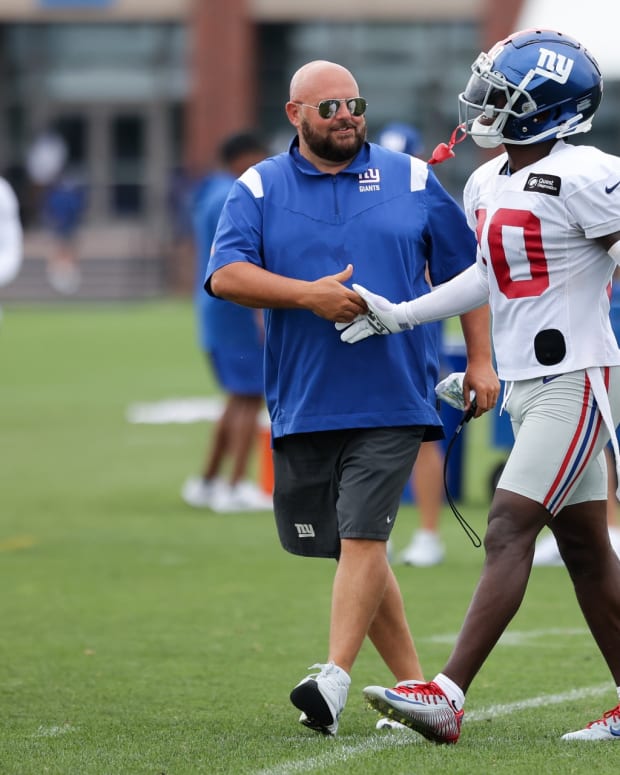 Jul 29, 2022; East Rutherford, NJ, USA; New York Giants head coach Brian Daboll shakes hands with cornerback Darnay Holmes (30) after an interception during training camp at Quest Diagnostics Training Facility.