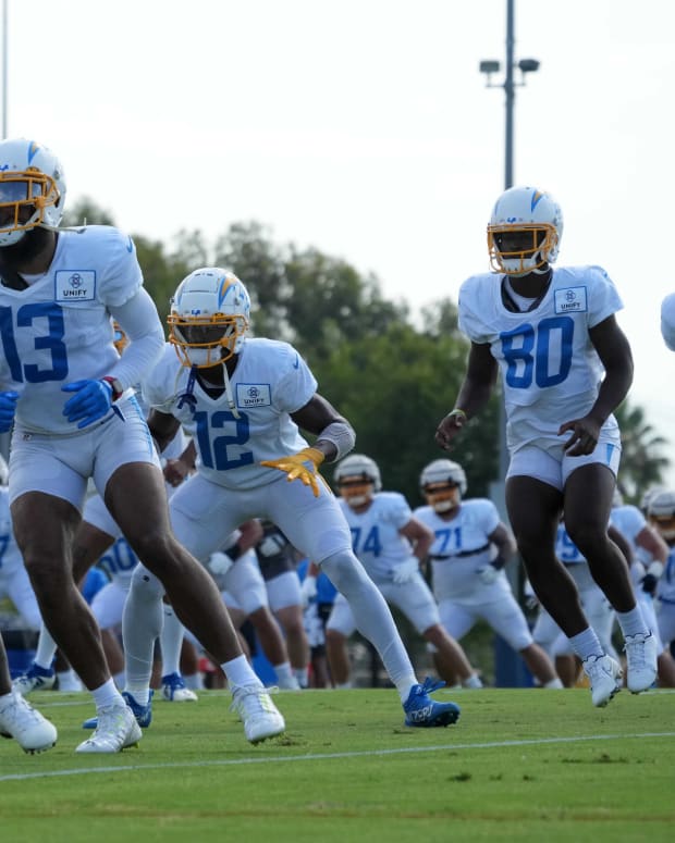 Aug 1, 2022; Costa Mesa, CA, USA; Los Angeles Chargers receivers Keenan Allen (13), Joe Reed (12), Maurice Ffrench (80) and Jason Moore Jr. (11) participate in drills during training camp at the Jack Hammett Sports Complex. Mandatory Credit: Kirby Lee-USA TODAY Sports