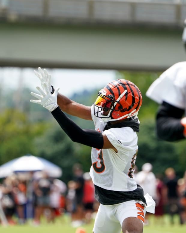 Cincinnati Bengals wide receiver Tyler Boyd (83) catches a pass as Cincinnati Bengals wide receiver Ja'Marr Chase (1) runs a route during Cincinnati Bengals training camp practice, Monday, Aug. 1, 2022, at the practice fields next to Paul Brown Stadium in Cincinnati. Cincinnati Bengals Training Camp Aug 1 0020