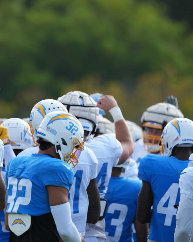 Aug 1, 2022; Costa Mesa, CA, USA; Los Angeles Chargers players huddle during training camp at the Jack Hammett Sports Complex. Mandatory Credit: Kirby Lee-USA TODAY Sports