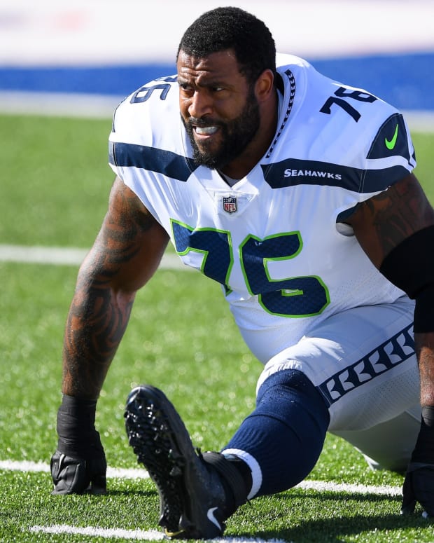 Seattle Seahawks OT Duane Brown stretching before game