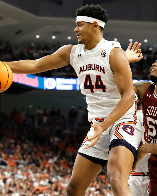 Mar 5, 2022; Auburn, Alabama, USA; Auburn Tigers center Dylan Cardwell (44) grabs a rebound against South Carolina Gamecocks forward Ta'Quan Woodley (55) during the first half at Neville Arena. Mandatory Credit: John Reed-USA TODAY Sports