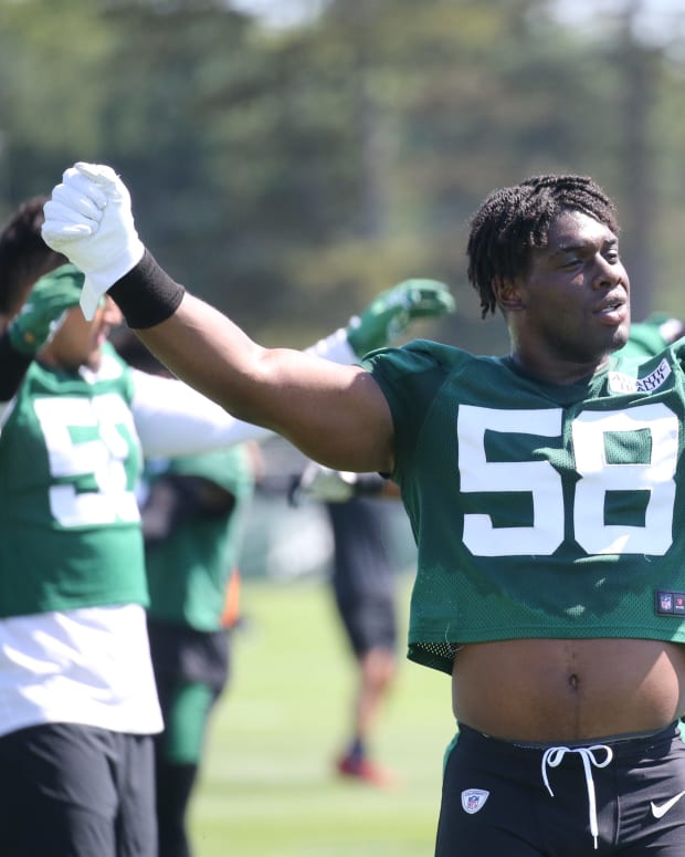 Defensive lineman Carl Lawson loosens up during the opening day of the 2022 New York Jets Training Camp in Florham Park, NJ on July 27, 2022. Opening Of The 2022 New York Jets Training Camp In Florham Park Nj On July 27 2022