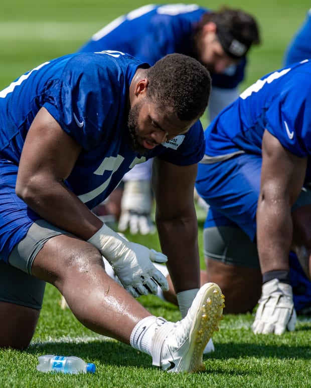 Jul 27, 2022; East Rutherford, NJ, USA; New York Giants offensive lineman Evan Neal (70) stretches during training camp at Quest Diagnostics Training Facility.