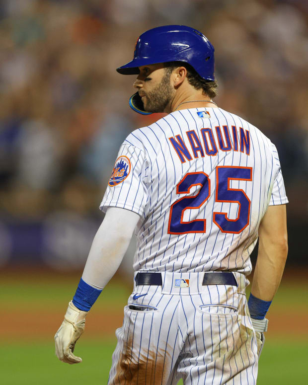 Aug 8, 2022; New York City, New York, USA; New York Mets right fielder Tyler Naquin (25) looks back after his two RBI triple during the eighth inning against the Cincinnati Reds at Citi Field.