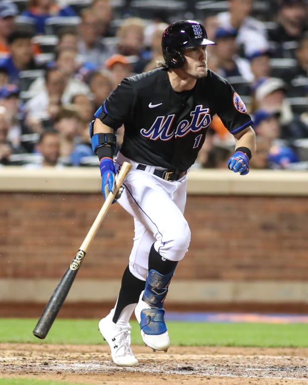 Aug 5, 2022; New York City, New York, USA; New York Mets second baseman Jeff McNeil (1) hits an RBI single in the fifth inning against the Atlanta Braves at Citi Field.