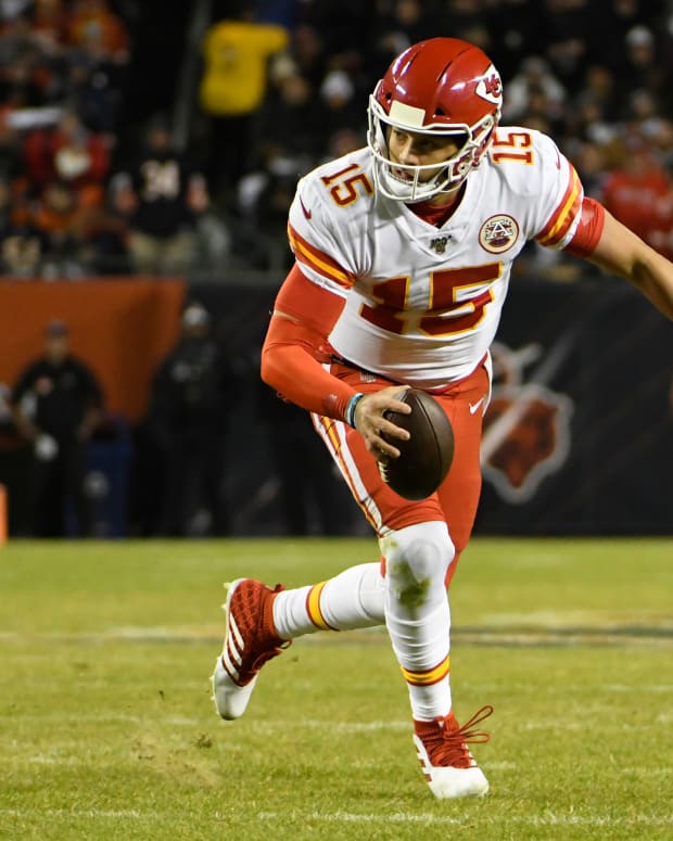 Dec 22, 2019; Chicago, Illinois, USA; Kansas City Chiefs quarterback Patrick Mahomes (15) runs for a touchdown against the Chicago Bears during the first half at Soldier Field. Mandatory Credit: David Banks-USA TODAY Sports