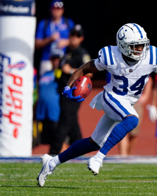 Aug 13, 2022; Orchard Park, New York, USA; Indianapolis Colts cornerback Isaiah Rodgers (34) returns a kick against the Buffalo Bills during the first half at Highmark Stadium. Mandatory Credit: Gregory Fisher-USA TODAY Sports
