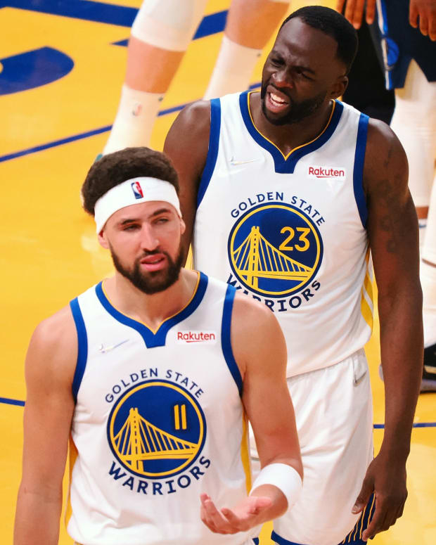 May 20, 2022; San Francisco, California, USA; Golden State Warriors guard Klay Thompson (11) and forward Draymond Green (23) react after Thompson is called for a foul against the Dallas Mavericks during the second quarter of game two of the 2022 western conference finals at Chase Center. Mandatory Credit: Kelley L Cox-USA TODAY Sports