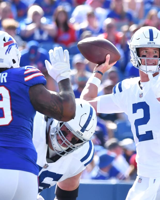 Aug 13, 2022; Orchard Park, New York, USA; Indianapolis Colts quarterback Matt Ryan (2) throws a pass as Buffalo Bills defensive tackle Tim Settle (99) rushes in the first quarter pre-season game at Highmark Stadium.