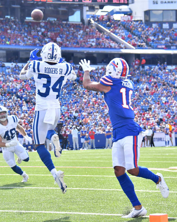 Aug 13, 2022; Orchard Park, New York, USA; Indianapolis Colts cornerback Isaiah Rodgers (34) makes an interception over Buffalo Bills wide receiver Khalil Shakir (10) in the second quarter pre-season game at Highmark Stadium. Mandatory Credit: Mark Konezny-USA TODAY Sports