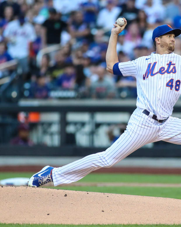 Aug 13, 2022; New York City, New York, USA; New York Mets starting pitcher Jacob deGrom (48) pitches in the first inning against the Philadelphia Phillies at Citi Field.