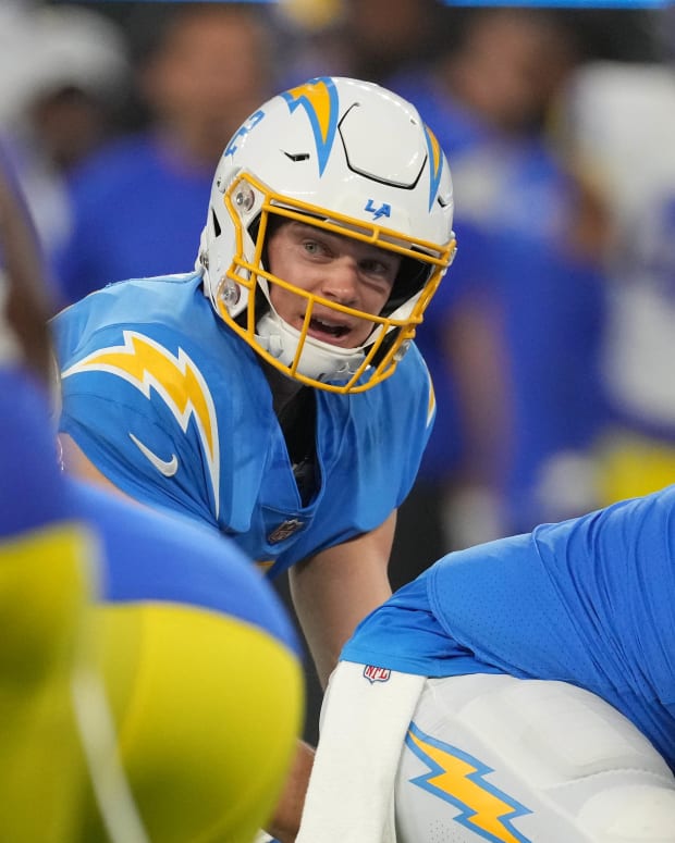 Aug 13, 2022; Inglewood, California, USA; Los Angeles Chargers quarterback Easton Stick (2) takes the snap in the second half against the Los Angeles Rams in the second half at SoFi Stadium. Mandatory Credit: Kirby Lee-USA TODAY Sports