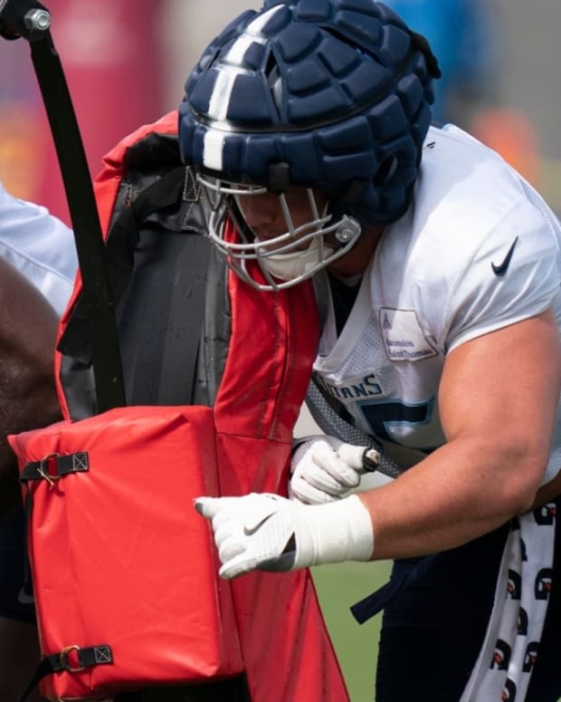 Tennessee Titans offensive tackle Dillon Radunz (75) pushes a tackling sled during a training camp practice at Ascension Saint Thomas Sports Park Thursday, Aug. 4, 2022, in Nashville, Tenn.