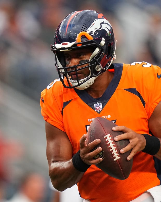 Denver Broncos quarterback Russell Wilson (3) warms up before the preseason game against the Dallas Cowboys at Empower Field at Mile High.