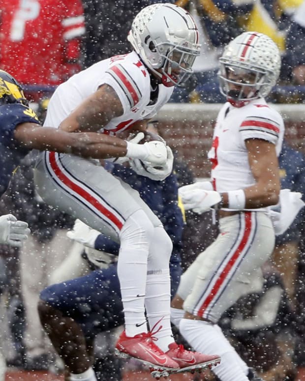 Ohio State Buckeyes wide receiver Jaxon Smith-Njigba (11) makes a catch against Michigan Wolverines defensive back Daxton Hill (30) during the first quarter of their NCAA College football at Michigan Stadium at Ann Arbor, Mi on November 27, 2021. Osu21um Kwr 14