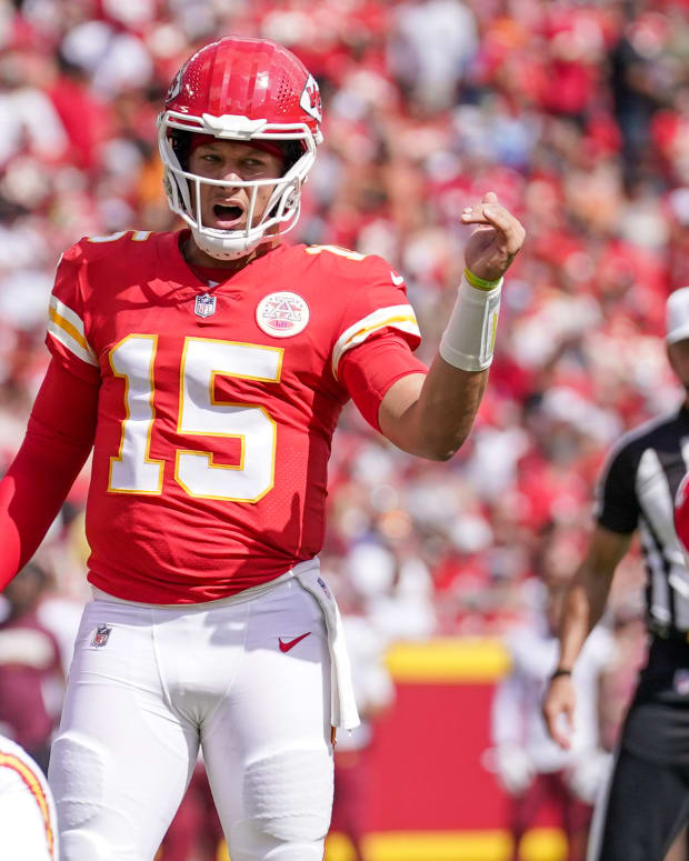 Aug 20, 2022; Kansas City, Missouri, USA; Kansas City Chiefs quarterback Patrick Mahomes (15) gestures on the line of scrimmage against the Washington Commanders during the first half at GEHA Field at Arrowhead Stadium. Mandatory Credit: Denny Medley-USA TODAY Sports