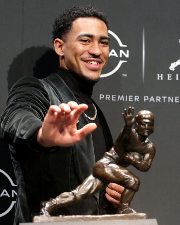2021 Heisman winner Alabama quarterback Bryce Young poses for pictures with the trophy during a press conference at the New York Marriott Marquis in New York City.