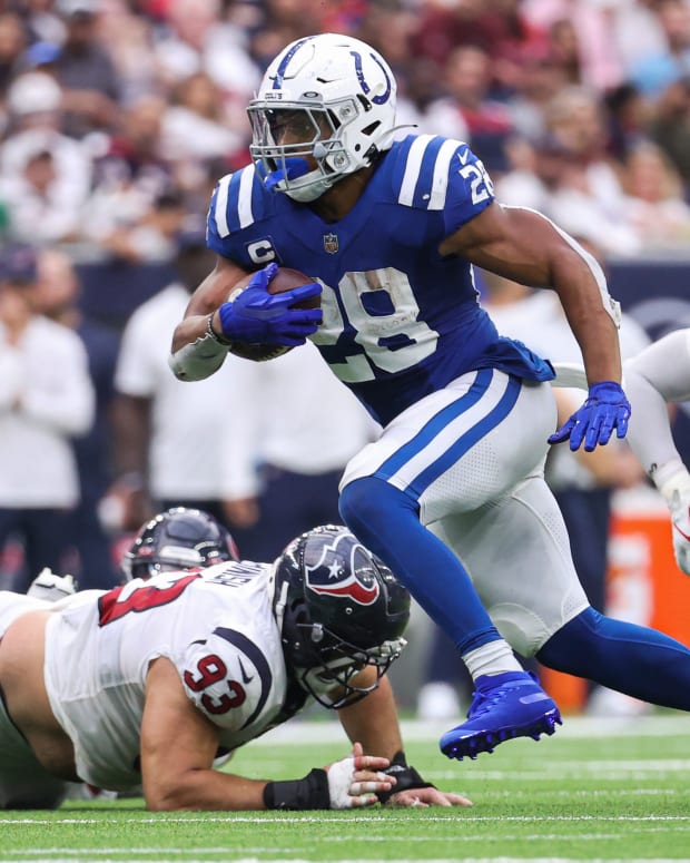 Sep 11, 2022; Houston, Texas, USA; Indianapolis Colts running back Jonathan Taylor (28) runs with the ball during the fourth quarter against the Houston Texans at NRG Stadium.