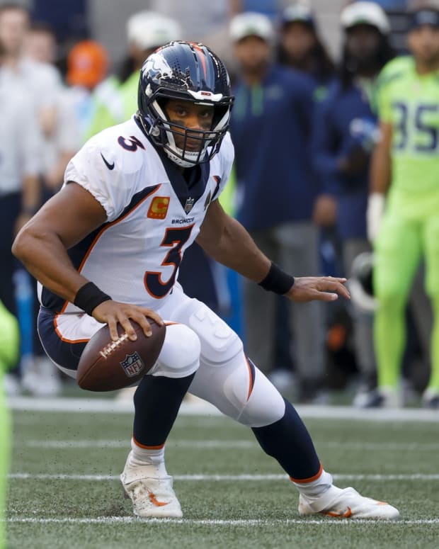 Denver Broncos quarterback Russell Wilson (3) looks to pass against the Seattle Seahawks during the first quarter at Lumen Field.