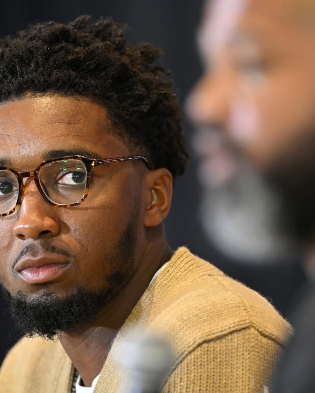 Cleveland Cavaliers guard Donovan Mitchell listens to head coach J.B. Bickerstaff during an introductory press conference at Rocket Mortgage FieldHouse.