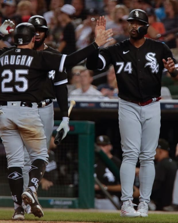 Sep 17, 2022; Detroit, Michigan, USA; Chicago White Sox left fielder Eloy Jimenez (74) and center fielder Luis Robert (88) celebrate as first baseman Andrew Vaughn (25) scores a run against the Detroit Tigers at Comerica Park. Mandatory Credit: Brian Sevald-USA TODAY Sports