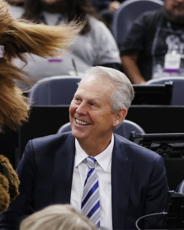 Danny Ainge is greeted by Jazz Bear as he watches pregame activities after being appointed Alternate Governor and CEO of Utah Jazz Basketball prior to their game against the LA Clippers at Vivint Arena.