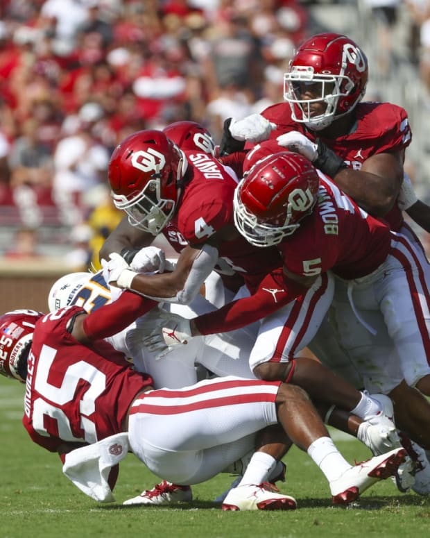 Sep 3, 2022; Norman, Oklahoma, USA; UTEP Miners running back Jalen Joseph (25) is tackled by Oklahoma Sooners defensive back Justin Broiles (25) and Oklahoma Sooners defensive back Jaden Davis (4) during the first half at Gaylord Family-Oklahoma Memorial Stadium. Mandatory Credit: Kevin Jairaj-USA TODAY Sports