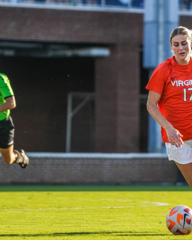 Virginia women's soccer forward Haley Hopkins dribbles the ball against North Carolina.