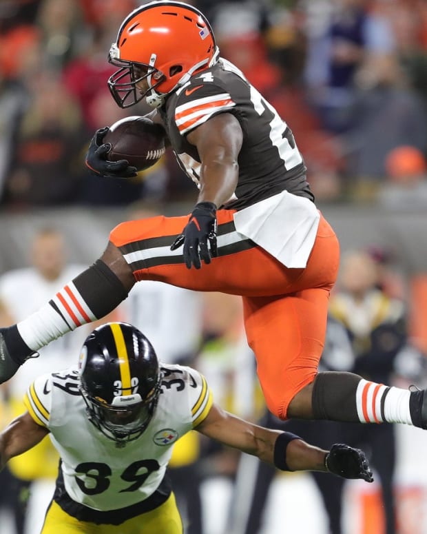 Browns running back Nick Chubb hurdles Steelers safety Minkah Fitzpatrick as he picks up a first down during the first half Thursday, Sept. 22, 2022, in Cleveland. Brownssteelers 5
